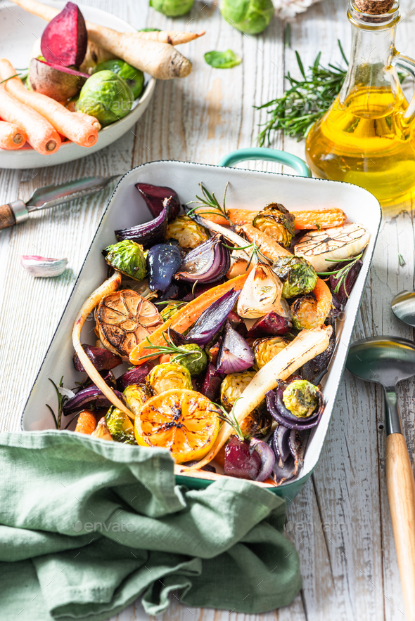 Mixed root vegetable roast with herbs. Healthy simple grill food Stock